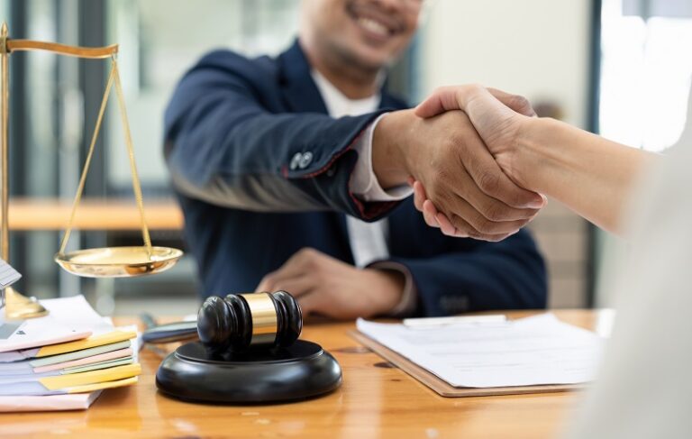 lawyer or attorneys shaking hand with client after 2022 10 06 20 58 07 utc 768x487