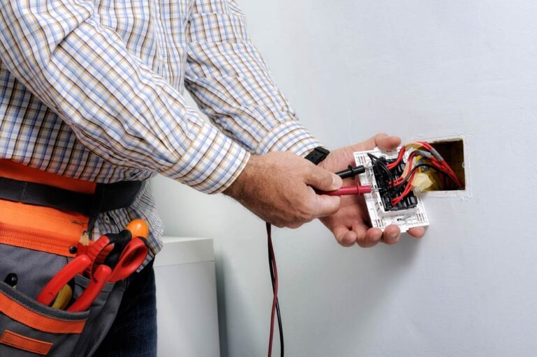 certified electrician installing an outlet 768x511